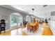 Elegant dining area with natural lighting and views of the pool area at 1141 Myrtle Rd, Valrico, FL 33596