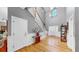 An elegant foyer with wood floors, staircase, and decorative lighting fixture at 1141 Myrtle Rd, Valrico, FL 33596