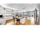 Bright, open kitchen with granite counters, custom cabinetry, stainless appliances, and island seating at 1141 Myrtle Rd, Valrico, FL 33596
