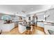 Open-concept kitchen with stainless steel appliances, a large island, and bar stool seating at 1141 Myrtle Rd, Valrico, FL 33596