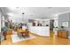 Open concept living space featuring dining area, expansive cabinetry, and hardwood floors at 1141 Myrtle Rd, Valrico, FL 33596