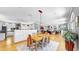 Open floor plan showcasing the dining area, kitchen, and living room with abundant natural light at 1141 Myrtle Rd, Valrico, FL 33596