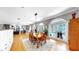 Open concept living space with arched windows overlooking the pool, and a formal dining area at 1141 Myrtle Rd, Valrico, FL 33596
