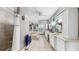 Spacious main bathroom with double sinks, a shower, a large soaking tub, and natural stone floors at 1141 Myrtle Rd, Valrico, FL 33596