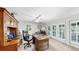 Home office features hardwood furnishings, ceiling fan and natural light at 1141 Myrtle Rd, Valrico, FL 33596
