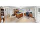 Spacious home office features hardwood furnishings and neutral carpeting at 1141 Myrtle Rd, Valrico, FL 33596