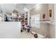 Walk-in pantry with extensive shelving, offering ample storage space and a window for natural light at 1141 Myrtle Rd, Valrico, FL 33596
