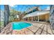 Beautiful backyard showcasing a screened-in pool area with brick pavers and attached patio at 1141 Myrtle Rd, Valrico, FL 33596