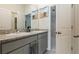 Clean bathroom with double granite sinks and chrome fixtures at 12401 Shining Willow St, Riverview, FL 33579