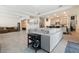 Open floor plan featuring a large living room and kitchen with a large sectional and tile floors at 12401 Shining Willow St, Riverview, FL 33579