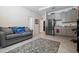 Versatile living area equipped with a kitchenette, offering comfort and functionality at 12401 Shining Willow St, Riverview, FL 33579