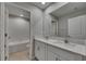 Stylish bathroom features a double vanity and a separate door for privacy at 12617 Maple Bonsai Dr, Riverview, FL 33579
