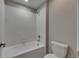 Clean bathroom featuring a shower and tub combo with classic white subway tile at 12617 Maple Bonsai Dr, Riverview, FL 33579