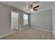 This bedroom boasts a ceiling fan and a window offering natural light at 12617 Maple Bonsai Dr, Riverview, FL 33579