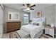 Bright bedroom with a ceiling fan, neutral walls, and ample space for relaxation at 12617 Maple Bonsai Dr, Riverview, FL 33579