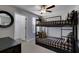 Comfortable ' bedroom with bunk beds and a convenient closet space at 12617 Maple Bonsai Dr, Riverview, FL 33579