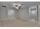 Spacious bonus room featuring neutral walls, carpet, and a ceiling fan for added comfort at 12617 Maple Bonsai Dr, Riverview, FL 33579