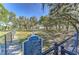Fenced dog park with shade trees and clear signage indicating park rules for responsible pet owners at 12617 Maple Bonsai Dr, Riverview, FL 33579