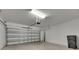 Spacious garage features a new garage door and garage door opener at 12617 Maple Bonsai Dr, Riverview, FL 33579