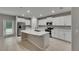 Bright kitchen with stainless steel appliances and a large center island with a sink at 12617 Maple Bonsai Dr, Riverview, FL 33579