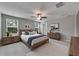 Comfortable main bedroom with natural light, contemporary decor, and ample space at 12617 Maple Bonsai Dr, Riverview, FL 33579