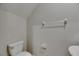 Simple powder room with a toilet, sink, and neutral wall color at 12617 Maple Bonsai Dr, Riverview, FL 33579
