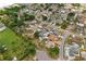 The property in a peaceful suburban setting with mature trees and a nearby lake at 12804 Bert Pl, Tampa, FL 33625