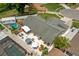 Aerial view of the property featuring a backyard with a pool, patio, and screen porch at 12804 Bert Pl, Tampa, FL 33625