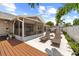 Inviting outdoor living space perfect for relaxing in lounge chairs or enjoying the screened patio at 12804 Bert Pl, Tampa, FL 33625