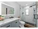 Modern bathroom featuring a glass shower, elegant vanity, and a sleek, contemporary design at 12804 Bert Pl, Tampa, FL 33625