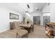 Bright dining room featuring a wooden table with seating and a modern chandelier at 12804 Bert Pl, Tampa, FL 33625
