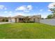 Well-maintained single-story home featuring a lush green lawn and charming curb appeal at 12804 Bert Pl, Tampa, FL 33625