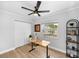 Home office includes a functional work space, a large window offering outdoor views, and ample storage solutions at 12804 Bert Pl, Tampa, FL 33625