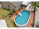 Aerial view of the pool featuring a deck, perfect for relaxation and outdoor enjoyment at 12804 Bert Pl, Tampa, FL 33625