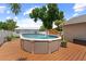 Inviting above ground swimming pool with deck, perfect for enjoying a refreshing swim on a warm day at 12804 Bert Pl, Tampa, FL 33625
