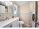 Bathroom featuring modern fixtures, decorative tiling, a vanity with sink and a toilet at 12901 College Hill Dr, Hudson, FL 34667