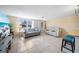 Bright living room with tile flooring, neutral walls, and ample seating arrangements at 12901 College Hill Dr, Hudson, FL 34667