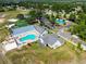 Aerial view showcases community amenities, including a pool, tennis courts, and clubhouse at 13028 Prestwick Dr, Riverview, FL 33579