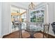 Charming breakfast nook featuring a glass table, adjacent to the outdoor patio with sliding glass doors at 13028 Prestwick Dr, Riverview, FL 33579