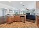Open-concept kitchen boasts granite counters, stainless appliances, and seamless flow to living spaces at 13028 Prestwick Dr, Riverview, FL 33579