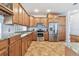 Well-equipped kitchen with stainless steel appliances, granite countertops, and ample cabinet space at 13028 Prestwick Dr, Riverview, FL 33579