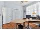 Home office area features wood floors, a large desk, and plenty of natural light at 13028 Prestwick Dr, Riverview, FL 33579