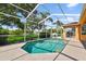 Beautiful pool area with screened enclosure and well-maintained landscaping at 13028 Prestwick Dr, Riverview, FL 33579