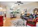 Open-concept living space with views into the dining area, featuring hardwood floors and neutral decor at 13205 Cypress Hill Dr, Hudson, FL 34669
