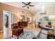 Spacious living area with hardwood floors, stylish furniture, and views into other parts of the house at 13205 Cypress Hill Dr, Hudson, FL 34669