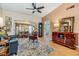 Comfortable living room showcasing a view to the sunroom with hardwood floors and neutral paint at 13205 Cypress Hill Dr, Hudson, FL 34669