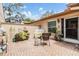 Cozy patio space with brick flooring and comfortable seating arrangement at 13205 Cypress Hill Dr, Hudson, FL 34669
