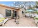 Relaxing patio featuring a white fence and stylish outdoor furniture arrangement at 13205 Cypress Hill Dr, Hudson, FL 34669