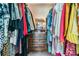 Walk-in closet features plenty of hanging space and wooden storage to maximize organization and space at 13205 Cypress Hill Dr, Hudson, FL 34669