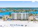 Gulf front condo building with Intracoastal views, beach access, and lush landscaping at 13500 Gulf Blvd # 706, Madeira Beach, FL 33708